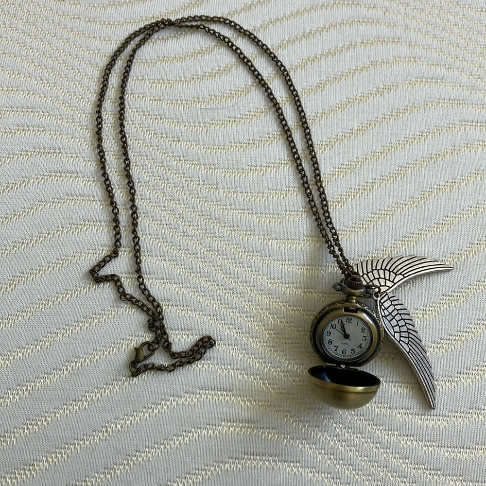 Harry Potter Golden Snitch functional time piece.